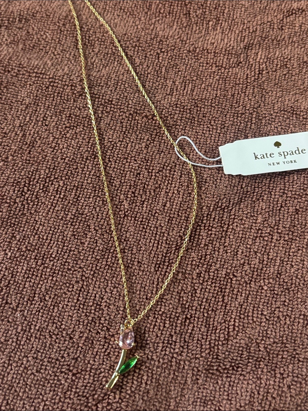 kate spade gold-tone necklace with pink tulip bud and green enamel leaf
